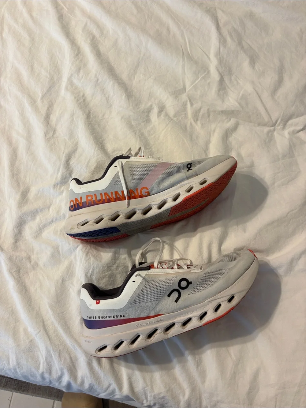 On Running Mens White Sneakers with Orange Accents